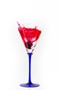 Cherry drop into red wine with splash Royalty Free Stock Photo