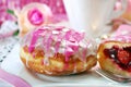 Cherry filled donuts with icing and coffee for valentines Royalty Free Stock Photo