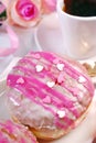 Cherry filled donuts with icing and coffee for valentines Royalty Free Stock Photo