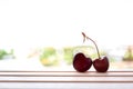 Cherry fruit Heart shapes on wooden table heart shaped from ripe fresh Cherries. Love and valentine day form food concept