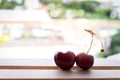 Cherry fruit Heart shapes on wooden table heart shaped from ripe fresh Cherries. Love and valentine day form food concept