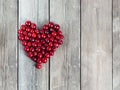 Cherry heart shape on a wooden rustic background Royalty Free Stock Photo