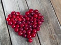 Cherry heart shape on a wooden rustic background Royalty Free Stock Photo