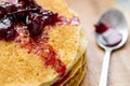 Cherry jam on blini - pancakes Royalty Free Stock Photo