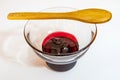 Cherry jam  in glass bowl and little wooden spoon Royalty Free Stock Photo