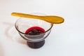 Cherry jam  in glass bowl and little wooden spoon Royalty Free Stock Photo