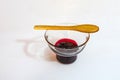 Cherry jam  in glass bowl and little wooden spoon Royalty Free Stock Photo