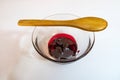Cherry jam  in glass bowl and little wooden spoon Royalty Free Stock Photo