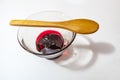 Cherry jam  in glass bowl and little wooden spoon Royalty Free Stock Photo