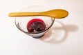 Cherry jam  in glass bowl and little wooden spoon Royalty Free Stock Photo