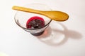 Cherry jam  in glass bowl and little wooden spoon Royalty Free Stock Photo