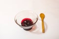 Cherry jam  in glass bowl and little wooden spoon Royalty Free Stock Photo