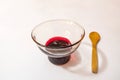 Cherry jam  in glass bowl and little wooden spoon Royalty Free Stock Photo