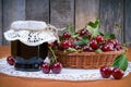 Cherry jam jar and fresh cherries Royalty Free Stock Photo