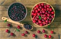 Cherry jam and red cherries in a basket on a wooden table. Royalty Free Stock Photo