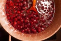 Cherry jam in a saucepan of rich color on a wooden spoon. Royalty Free Stock Photo