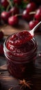 Cherry jam. Spoon scooping homemade cherry jam from a glass jar surrounded by fresh cherries Royalty Free Stock Photo