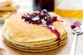 Cherry jam on a stack of pancakes Russian blini Royalty Free Stock Photo