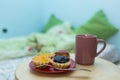 Cherry, kiwi, pineapple small tarts and a mug of coffee