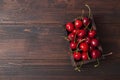 Cherry with leaf on plate and water dropsand on brown stone table Royalty Free Stock Photo