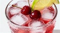 Cherry Limeade or Lemonade in drinking glass. Refreshing summer drink. Royalty Free Stock Photo