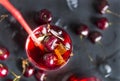 Cherry, limonada glass of cherry on a black background, berries Royalty Free Stock Photo
