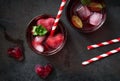 Cherry mint cocktail with vodka on a dark background. Top view