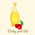 Cherry oil in jar or bottle near berries