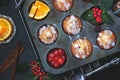 Cherry orange muffins in muffin baking pan Royalty Free Stock Photo