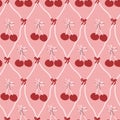 Cherry pattern with bows on pink background in repeating design