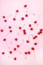 Cherry pattern sweet natural decoration creative on a pink background.Top view