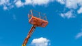 Cherry picker on blue sky background Royalty Free Stock Photo