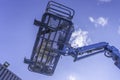 Cherry Picker Crane Underneath blue clear skies Royalty Free Stock Photo