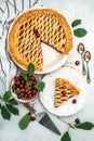 cherry pie, Flaky Crust, piece on a plate and the whole homemade cherry pie, place for text, top view Royalty Free Stock Photo