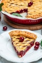cherry pie, Flaky Crust, piece on a plate and the whole homemade cherry pie, place for text, top view Royalty Free Stock Photo