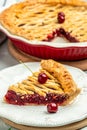 cherry pie, Flaky Crust, piece on a plate and the whole homemade cherry pie, place for text, top view Royalty Free Stock Photo