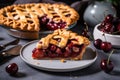 cherry pie on a white plate with slice cut out for serving