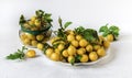 Cherry plum fruits in a white plate on a white background.Soft focus Royalty Free Stock Photo