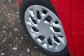 Cherry red car front detail with big light-alloy wheel Royalty Free Stock Photo