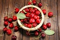 Cherry. Red fresh Cherries in bowl and a bunch of cherries on th Royalty Free Stock Photo