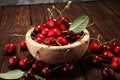 Cherry. Red fresh Cherries in bowl and a bunch of cherries on th Royalty Free Stock Photo