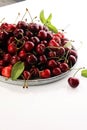 Cherry. Red fresh Cherries in bowl and a bunch of cherries on th Royalty Free Stock Photo