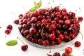 Cherry. Red fresh Cherries in bowl and a bunch of cherries on th Royalty Free Stock Photo