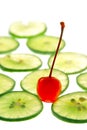 Cherry on slide lime on white background Royalty Free Stock Photo