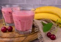 Cherry smoothie with banana and fresh cherries. Royalty Free Stock Photo