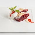 Cherry strudel with ice cream on a white plate Royalty Free Stock Photo