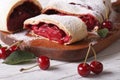 Cherry strudel on a wooden board close up. horizontal Royalty Free Stock Photo