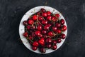 Cherry. Sweet Cherries in bowl on dark stone concrete background. Ripe Sweet Red Cherries Royalty Free Stock Photo