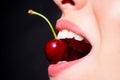 Cherry in teeth, macro, close up. Cherry in woman mouth. Beautiful girl, cherries in mouth. Cherries on woman lips. Girl