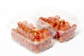 Cherry tomato in plastic container package, studio shoot on whit Royalty Free Stock Photo